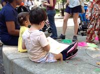 Children Exploring Books at the Goat Statue